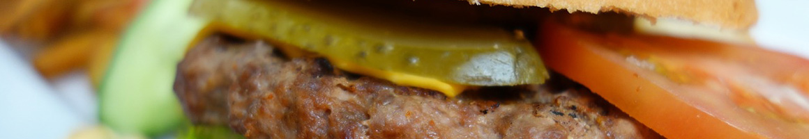 Eating Burger Greek Hot Dog at Gyros & More restaurant in Lorain, OH.